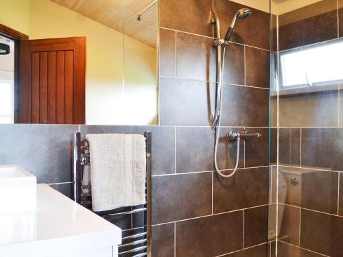 a bathroom with a shower and a sink at Appletree Lodge in Wilberfoss