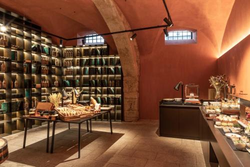 a store with a lot of shelves of wine bottles at Casa da Companhia, Vignette Collection by IHG in Porto