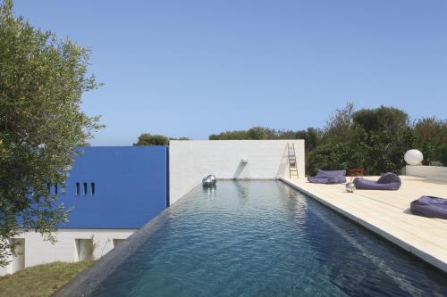 a swimming pool on the roof of a house at Calcebianca in Ostuni