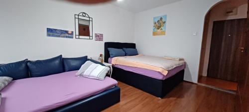 Ένα ή περισσότερα κρεβάτια σε δωμάτιο στο New Central Apartments