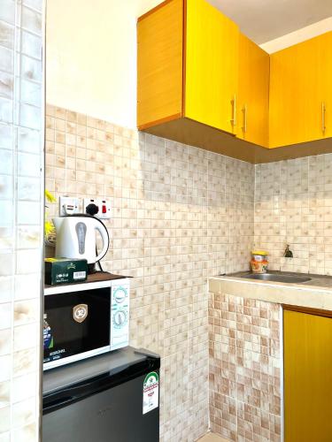 Kuchyň nebo kuchyňský kout v ubytování Comfy 1br Milimani