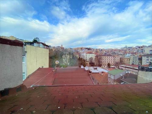 a tennis court on the roof of a building at Jazzy Homes - Modern & Stylish Flat - Bosphorus View, Terrace in Istanbul