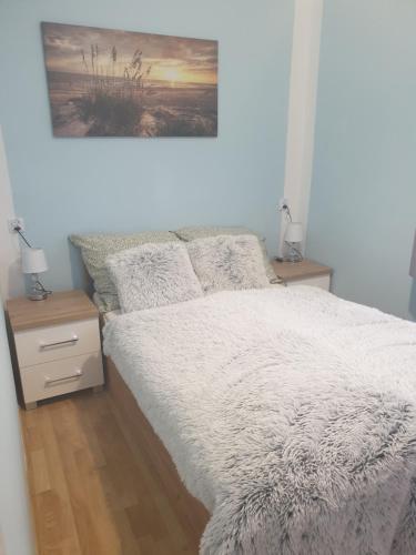 Posteľ alebo postele v izbe v ubytovaní Apartament Demiro