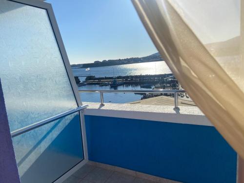 a balcony with a view of the water at Ribarska Sreshta Family Hotel in Tsarevo