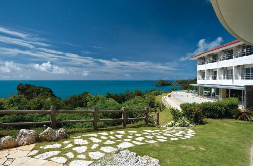 a resort with a view of the ocean at Hotel Hamahigashima Resort in Uruma