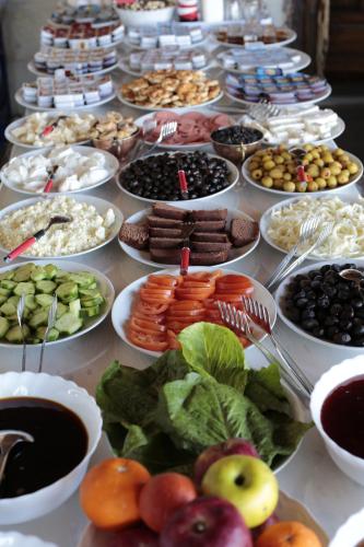 a table topped with lots of different types of food at Travel Inn Cave Hotel in Göreme