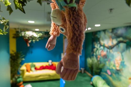 a stuffed animal hanging from the ceiling of a room at Hotell Heden - BW Signature Collection in Gothenburg