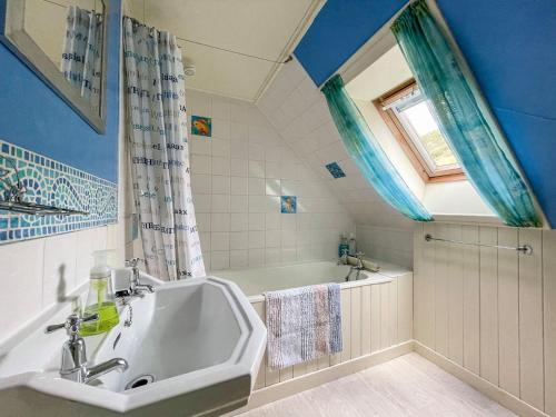 a bathroom with a sink and a bath tub at Dalcharn in Invernaver