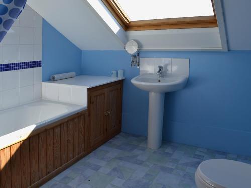 a bathroom with a sink and a toilet at Fenham Barn in Soulby