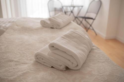 Postel nebo postele na pokoji v ubytování Rezidence Kbely