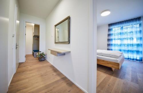 Postel nebo postele na pokoji v ubytování Hermitage Apartments