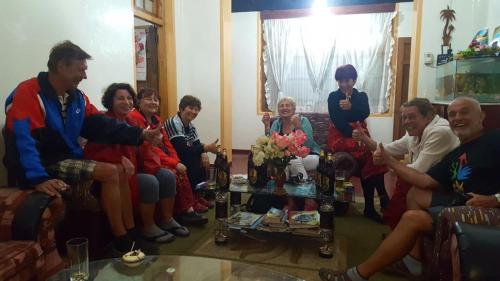 a group of people sitting in a living room at Bel View Guest House in Haputale