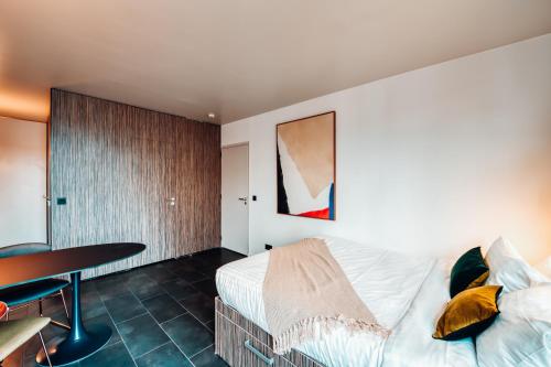 Cama o camas de una habitación en COWOOL Cergy