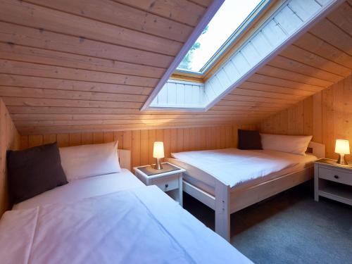 Postel nebo postele na pokoji v ubytování Strandpark Baabe - Haus 250