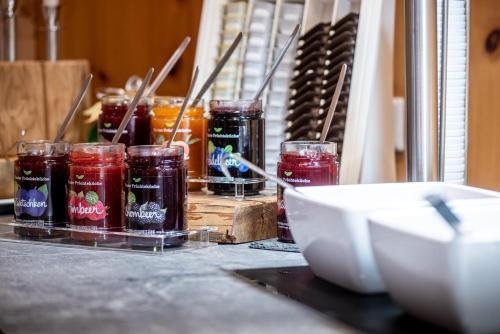 a group of jars of jam sitting on a counter at Naturhotel Tandler in Sankt Jakob in Defereggen