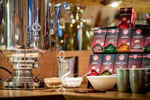 a food processor sitting on top of a counter with cupcakes at Naturhotel Tandler in Sankt Jakob in Defereggen