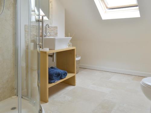 a bathroom with a sink and a toilet at The Lodge in Wedmore