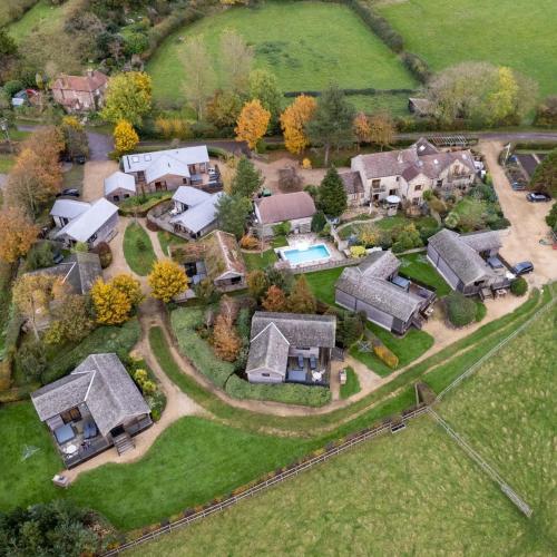an aerial view of a home with a pool at Tor Farm Lodges - Private Hot Tubs, Shared Seasonal Outdoor Pool, Dog Friendly in Cheddar