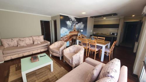 a living room with a couch and a table at Departamento Caseros in Salta