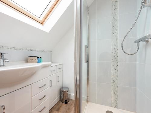 a bathroom with a shower and a sink at The Apple Loft in Mickleton