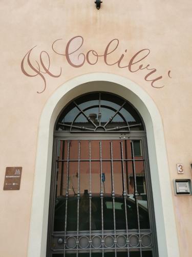 a sign over the door of a store at Il Colibrì Bed&Breakfast in Leno