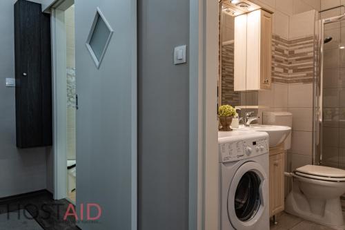 Koupelna v ubytování V68 Design Apartment - hostAID