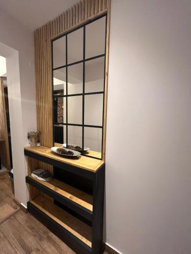 a dressing room with a mirror on a wall at WOOD Studio Sinaia in Sinaia