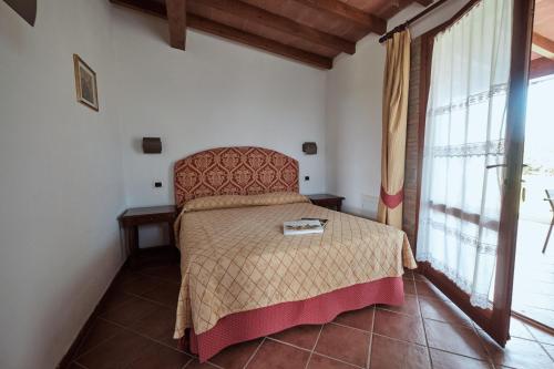 Postel nebo postele na pokoji v ubytování Agriturismo Pavone