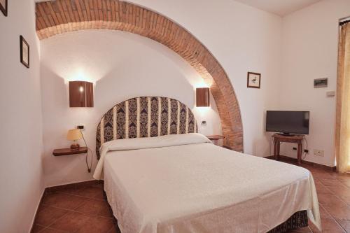 Postel nebo postele na pokoji v ubytování Agriturismo Pavone