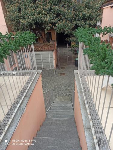 a set of stairs with a fence and trees at Residenza il Nespolo - Estella Hotel Collection in Turin