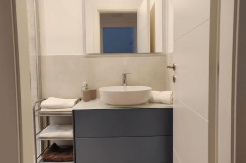 a bathroom with a sink and a mirror at La Casa di Dani in Genova