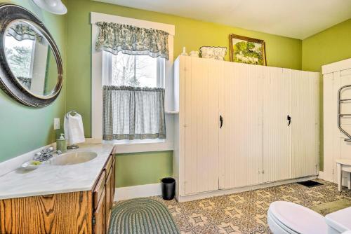 a bathroom with a sink and a mirror at Historic Mount Holly Vacation Rental in Hortonville
