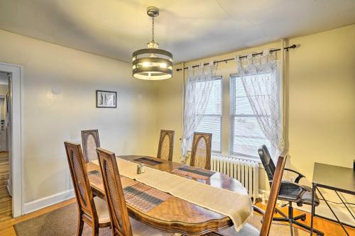 a dining room with a table and chairs and a window at Charming Albany Retreat about 3 Mi to Downtown! in Albany