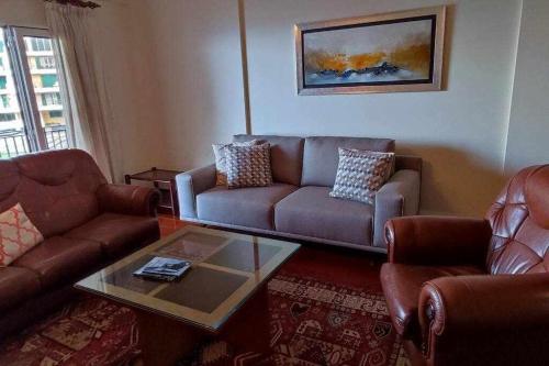 a living room with a couch and a coffee table at SeaBreezeBonimar in Funchal