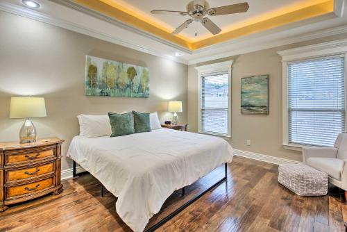 a bedroom with a bed and a ceiling fan at Spacious Golf Course Getaway in Hot Springs! in Hot Springs Village