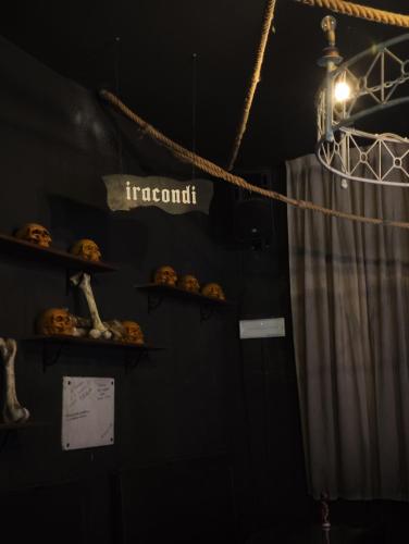 a room with shelves with pumpkins and a sign that reads important at Hotel Transilvania in Pian del Voglio
