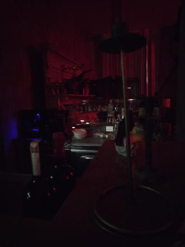 a dark kitchen with a table in the dark at Hotel Transilvania in Pian del Voglio