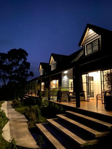 a house with steps leading up to it at night at Risco de Hugo in Boquete