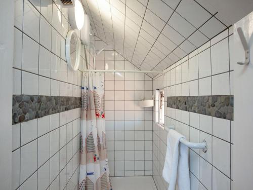 a bathroom with a shower with a shower curtain at Apartment Twelve - Uk39868 in Paignton