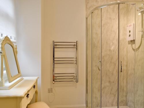 a bathroom with a shower and a sink at St Ronans Place in Gartocharn