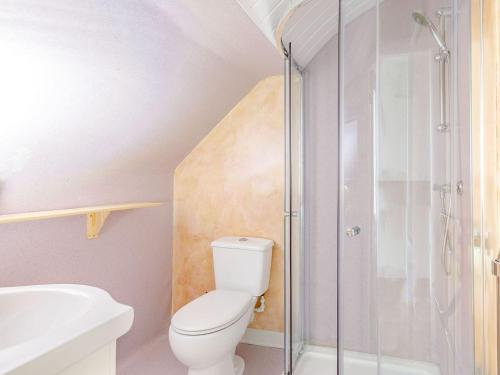 a bathroom with a toilet and a glass shower at Lister Suite - Uk38333 in Halifax