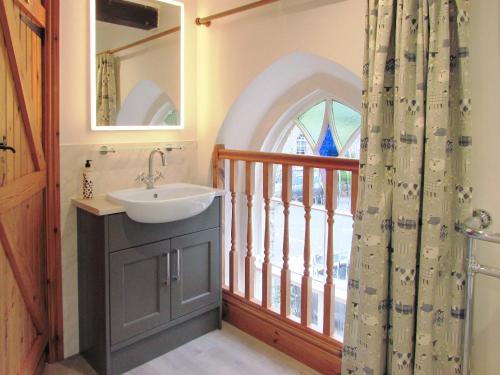a bathroom with a sink and a window at The Old Chapel in Aysgarth