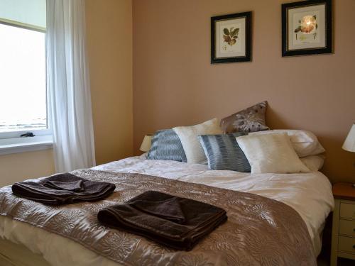 Ένα ή περισσότερα κρεβάτια σε δωμάτιο στο Archies Cottage