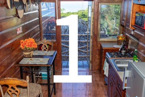 a kitchen with a table and a sink in a room at Bella Vista Vacation in Montego Bay
