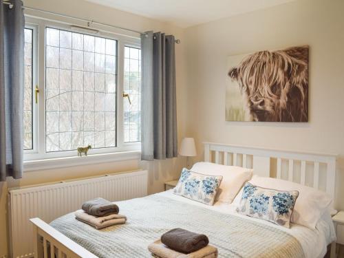 a bedroom with a bed and a window at Mainslea - Uk36872 in Dunure