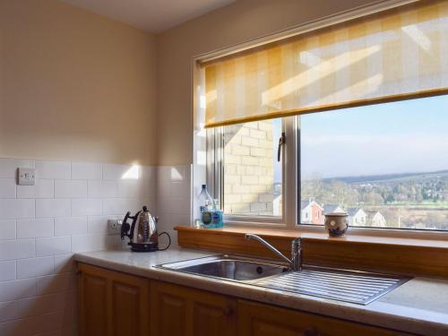 a kitchen with a sink and a window at Argyle View in Dunblane
