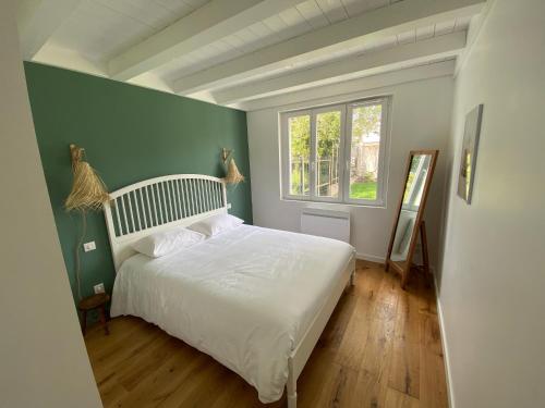Posteľ alebo postele v izbe v ubytovaní Maisonnette confortable à Pornic