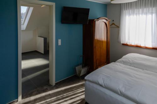 Postel nebo postele na pokoji v ubytování Hotel Brasserie Chaussee