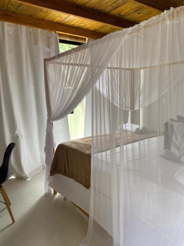 Postel nebo postele na pokoji v ubytování Chalés da Floresta
