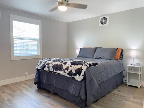 a bedroom with a bed and a window at Country Living-harrison Ranchhr3 in Visalia